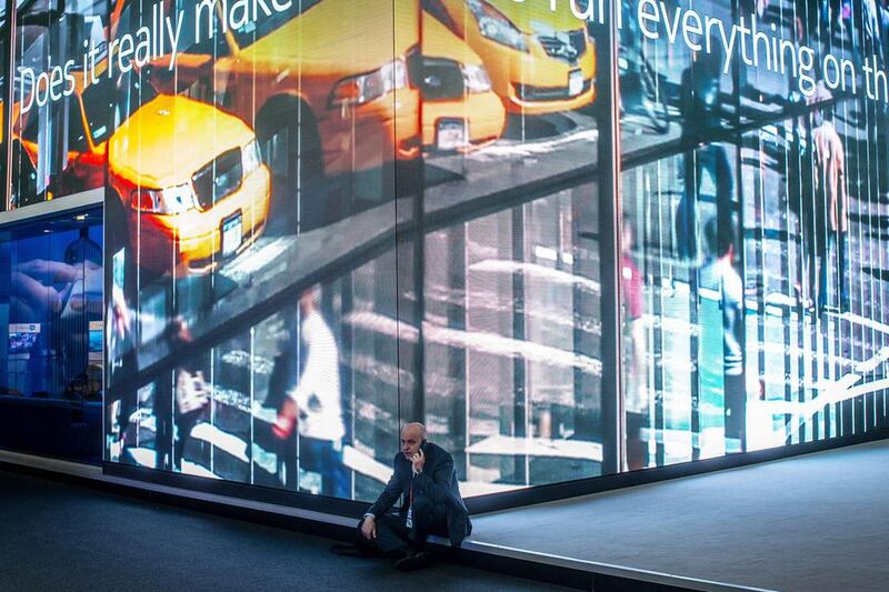 A visitor sits in front of the Nokia stand. David Ramos / Getty Images