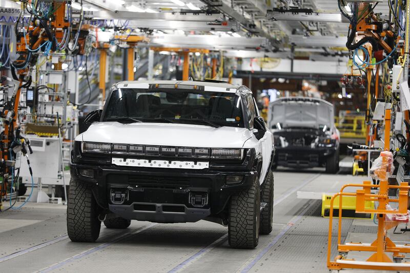 GMC Hummer EVs at General Motors Factory Zero in Detroit, Michigan. Demand for electric vehicles is at an all-time high for both mass-market and higher-end models, and factories are struggling to keep up. AFP