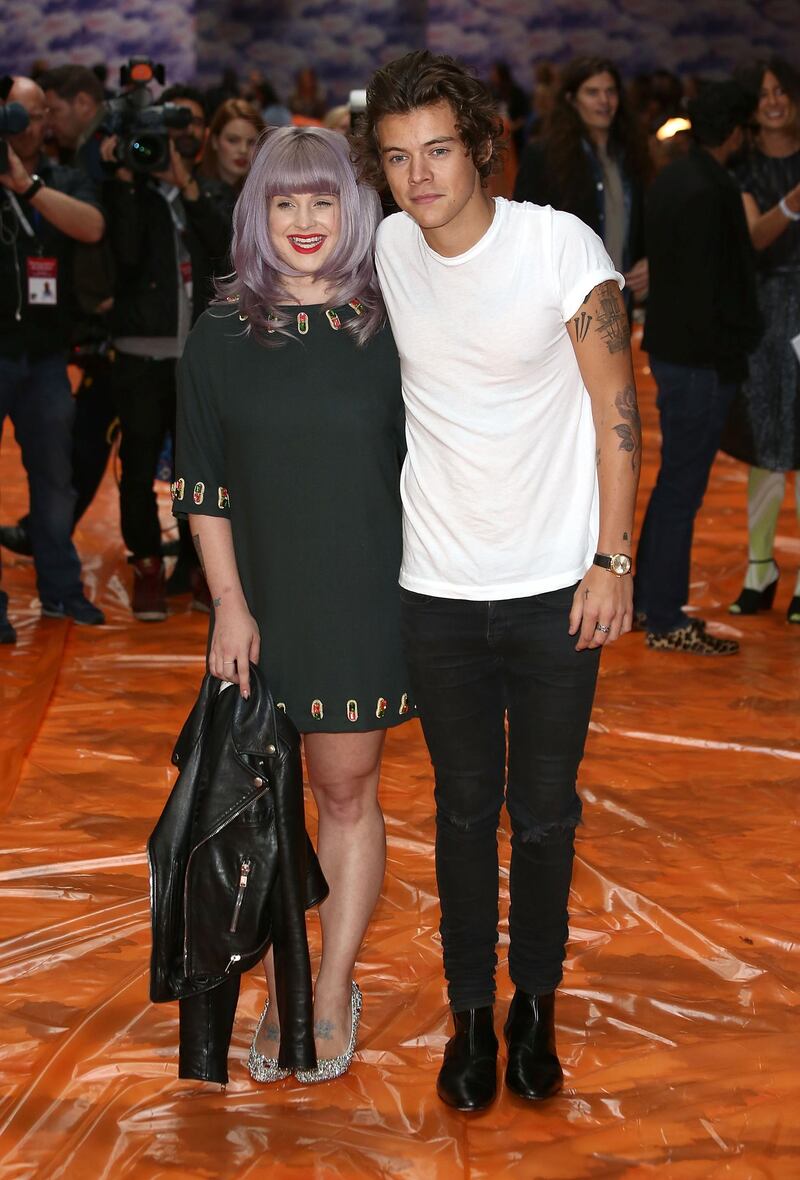 LONDON, ENGLAND - SEPTEMBER 14:  Kelly Osbourne and Harry Styles attend the House Of Holland show during London Fashion Week SS14 on September 14, 2013 in London, England.  (Photo by Tim P. Whitby/Getty Images)