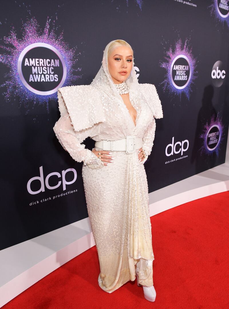 Christina Aguilera, wearing a white embellished hooded Jean Paul Gaultier dress, attends the 2019 American Music Awards on November 24, 2019 in Los Angeles, California. Getty Images