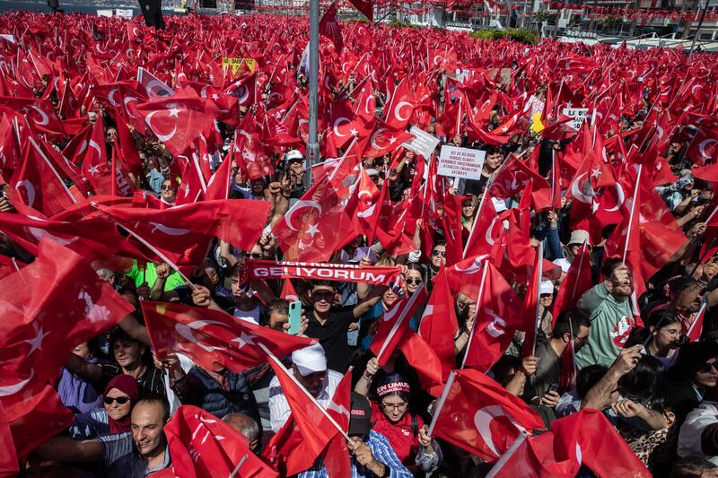 Supporters wave flags and chant while awaiting the arrival of CHP presidential candidate Kemal Kilicdaroglu at a campaign rally on Sunday in Izmir, Turkey. He is considered to pose a major threat to President Recep Tayyip Erdogan's long rule in the May elections. Getty