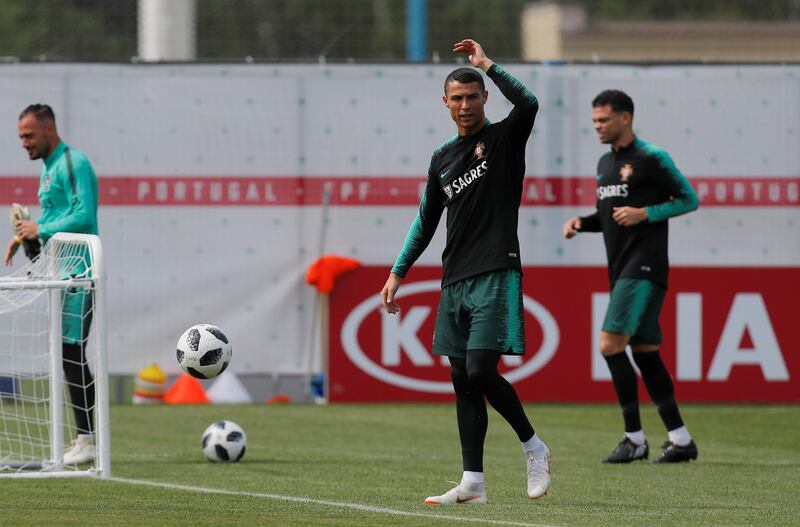 Cristiano Ronaldo, centre, and his teammates attend a training session in Kratovo, Moscow, Russia on June 12, 2018. Maxim Shemetov / Reuters