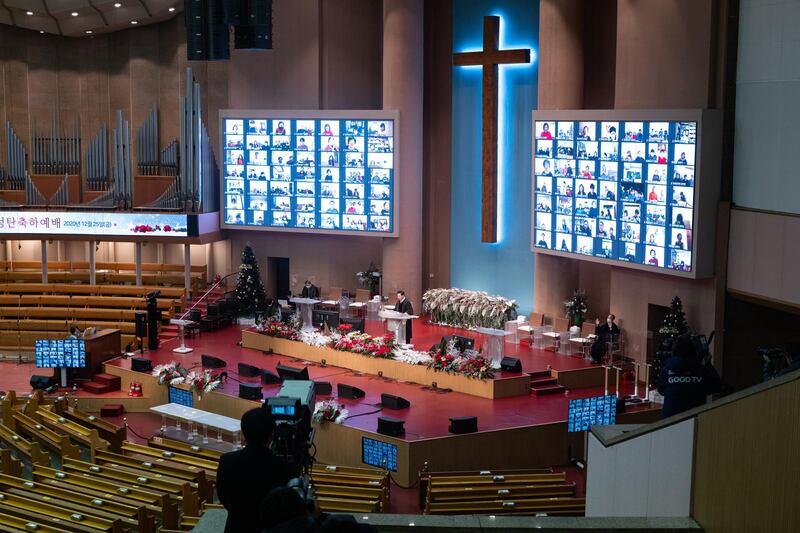 Parishioners (on screen) attend an online Christmas mass at the Yoido Full Gospel Church in Seoul, South Korea. EPA