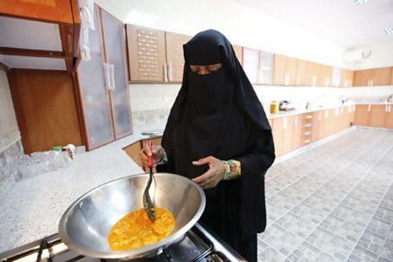 Souad Rabee Belal Al Budoor demonstrates how to make one of her spice mixes in her home in Umm Al Quwain. Sarah Dea / The National