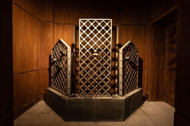 Bullet scarred mashrabiya screens from the grand mosque in Mecca, the result of an attack by insurgents in 1979 and now part of an art installation at Riyadh's Red Palace. Image courtesy of Athr and the artist