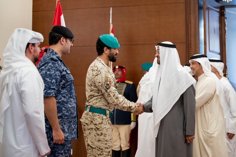 President Sheikh Mohamed greets Maj Gen Sheikh Nasser bin Hamad, Bahrain's National Security Adviser.