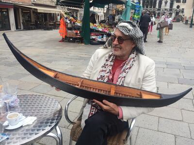 Iraqi artist Rashad Salim with his carved gondola. John Brunton