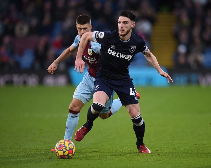 West Ham midfielder Declan Rice holds off a challenge from Burnley midfielder Johann Berg Gudmundsson. AFP