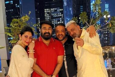 Mohanlal (in the centre, in red), posed for a picture along with Sanjay Dutt and his wife for Diwali. Instagram/ @mohanlal