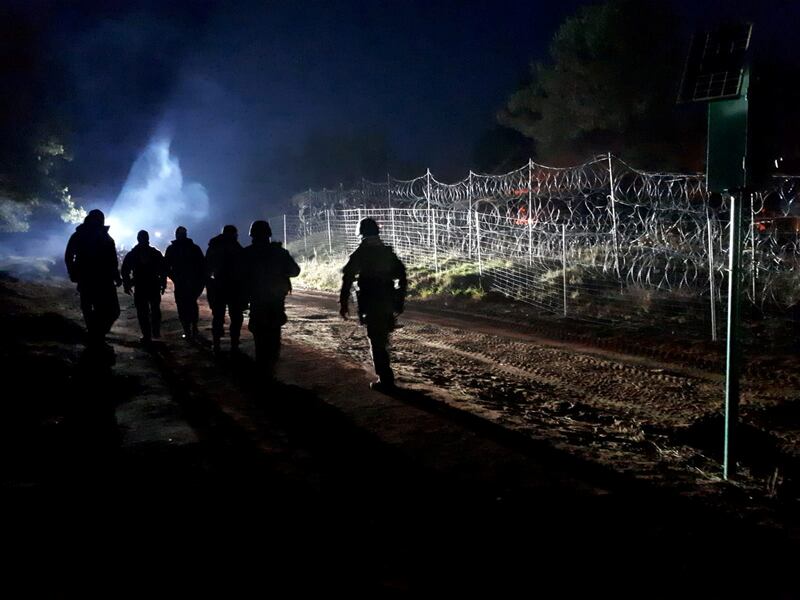Polish soldiers patrol the border near Kuznica, Poland. Reuters