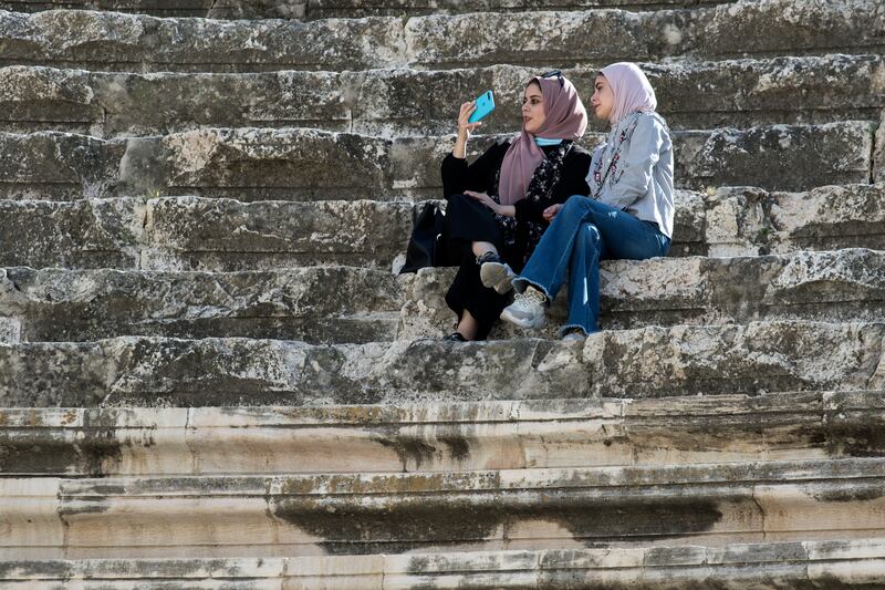 Young women enjoy fresh air and sun near the Amman citadel and Roman amphitheatre In Amman, Jordan. About 71 per cent of young Jordanians said they believed their voice mattered to their country's leadership. Photo: Hristo Vladev / NurPhoto