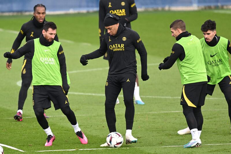 Kylian Mbappe fights for the ball with Marco Verratti and Lionel Messi during training. AFP