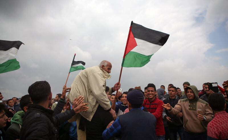 An elderly Palestinian man is carried by fellow protesters near the border with Israel east of Jabalia in the Gaza Strip. Mohammed Abed / AFP