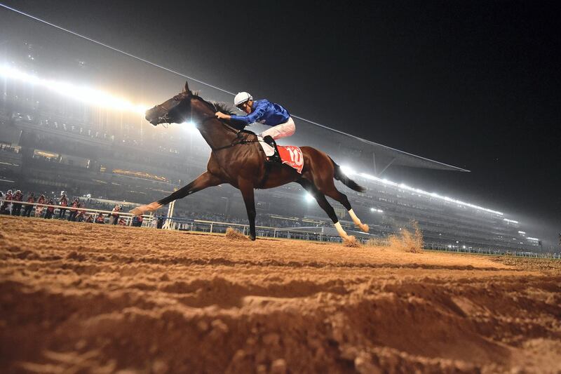 Jockey Christophe Soumillon rides Thunder Snow across the finish line to win the Dubai World Cup horse race at the Dubai World Cup in the Meydan Racecourse on March 31, 2018 in Dubai. (Photo by GIUSEPPE CACACE / AFP)