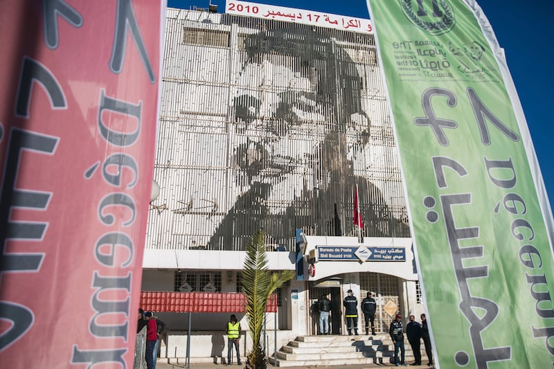 An image of street vendor Mohammed Bouazizi is depicted on the facade of the post office building in Sidi Bouzid. AP