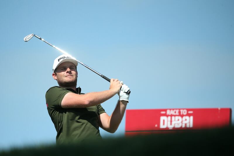 Tyrrell Hatton tees off on the 4th hole during the final round of the Omega Dubai Desert Classic. Francois Nel / Getty Images