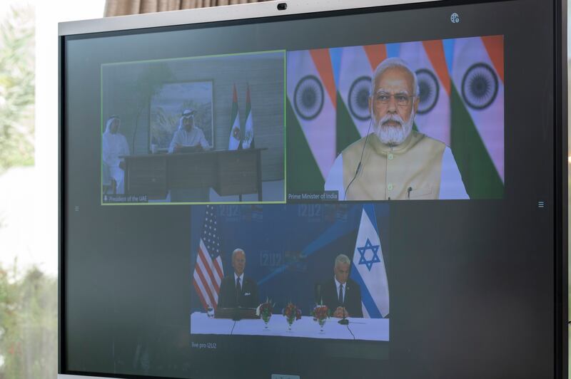 Sheikh Mohamed and Sheikh Abdullah bin Zayed on the left of the screen, with Narendra Modi, the prime minister of India, top right, and US President Joe Biden, left, and Yair Lapid, the prime minister of Israel, right.

