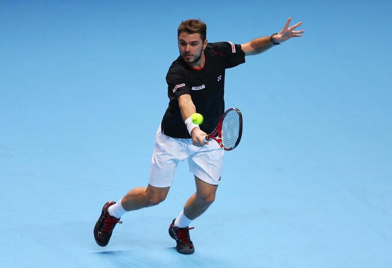 Stanislas Wawrinka of Switzerland survived a second-set stumble to defeat Tomas Berdych of the Czech Republic at the ATP World Tour Finals at O2 Arena in London. Wawrinka will face either David Ferrer or Rafael Nadal, who called on the ATP to consider other surfaces to play the Tour Finals, next.  Clive Brunskill / Getty Images