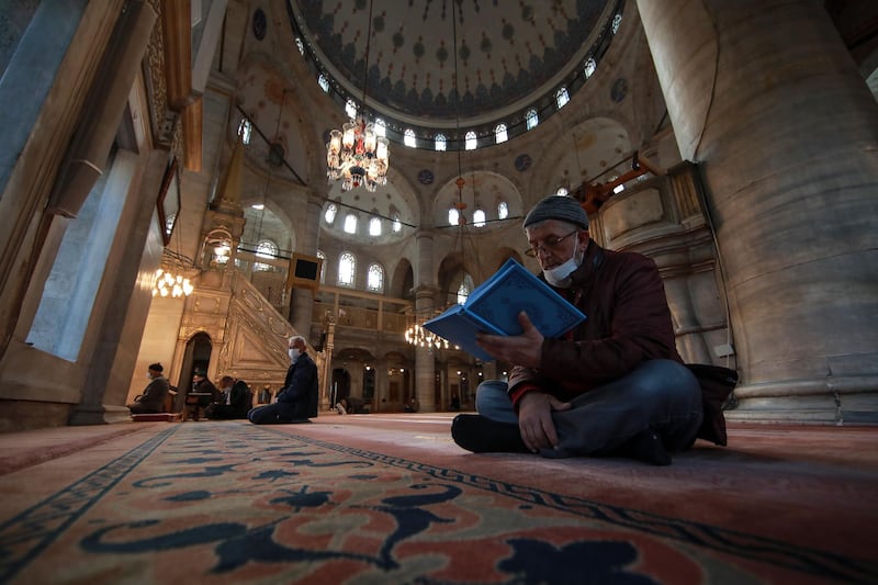 People pray at the Eyup Sultan Mosque, in Istanbul a day before Ramadan. Turkey's President Recep Tayyip Erdogan was forced to announce renewed restrictions following a spike on COVID-19 cases, such as weekend lockdowns and the closure of cafes and restaurants during Ramadan, the holy Muslim month, starting on April 13. AP Photo