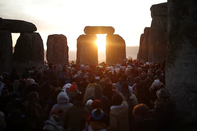 Revellers gather at the Stonehenge stone circle as they welcome in the winter solstice in December last year.  Reuters / Henry Nicholls