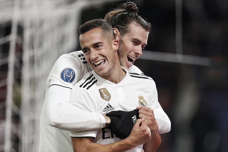 epa07193841 Real Madrid's Lucas Vazquez (front) celebrates with teammate Gareth Bale scoring during the UEFA Champions League group G soccer match between AS Roma and Real Madrid CF at the Olimpico Stadium in Rome, Italy, 27 November 2018.  EPA/RICCARDO ANTIMIANI