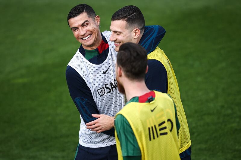 Portugal's players Cristiano Ronaldo (L) and Diogo Dalot (R) attend a training session at Cidade do Futebol in Oeiras, on the outskirts of Lisbon, Portugal, 22 March 2023.  Portugal play against Liechtenstein in the qualification for the UEFA EURO 2024 on 23 March.   EPA / RODRIGO ANTUNES