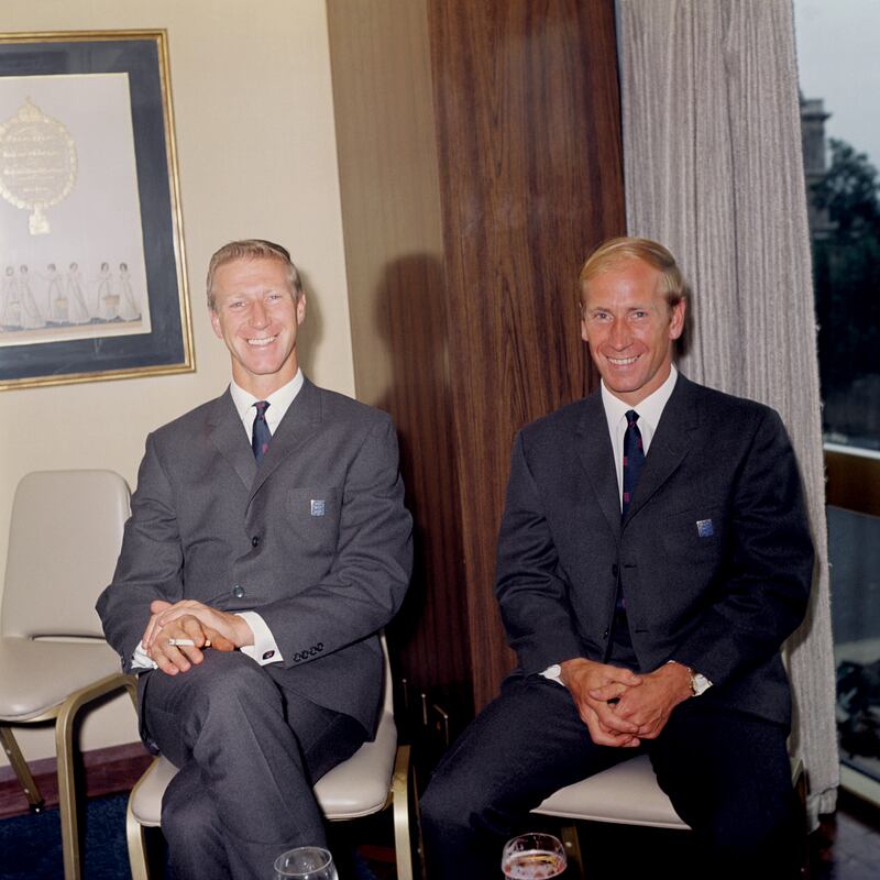England's Charlton brothers, Jack, left, and Bobby at a pre-tournament function in 1966. PA