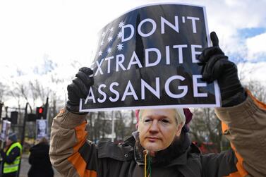 Julian Assange supporters protest outside Woolwich Crown Court in London. EPA