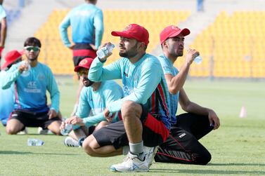 Afghanistan captain Rashid Khan, pictured during training at the Zayed Cricket Stadium in Abu Dhabi ahead of their tour to Bangladesh, hit a half century and took four wickets in the one-off Test on Friday. ​​​​Pawan Singh / The National
