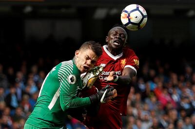 Soccer Football - Premier League - Manchester City vs Liverpool - Manchester, Britain - September 9, 2017   Manchester City’s Ederson Moraes is fouled by Liverpool's Sadio Mane resulting in a red card for Mane   Action Images via Reuters/Lee Smith  EDITORIAL USE ONLY. No use with unauthorized audio, video, data, fixture lists, club/league logos or "live" services. Online in-match use limited to 75 images, no video emulation. No use in betting, games or single club/league/player publications. Please contact your account representative for further details.