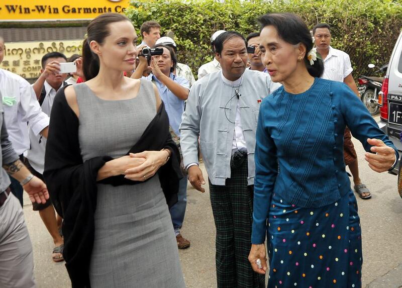 UNHCR goodwill ambassador Angelina Jolie and Myanmar opposition leader Aung San Suu Kyi arrive at a Yangon slum. Nyein Chan Naing/EPA