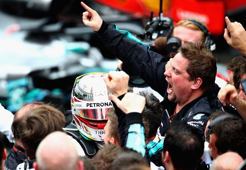 Race winner Lewis Hamilton of Great Britain and Mercedes GP celebrates in parc ferme after the Brazilian Grand Prix.  Getty Images