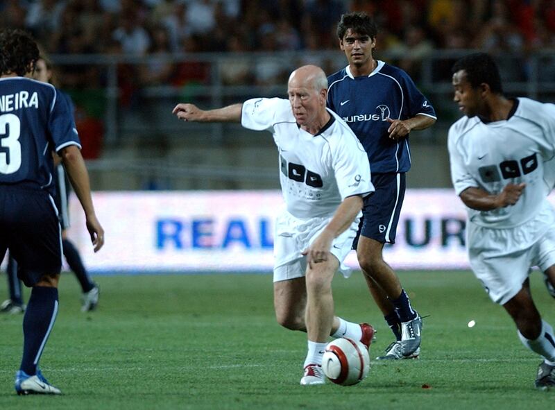 England legend Bobby Charlton playing for the Luis Figo foundation team in 2004. AP