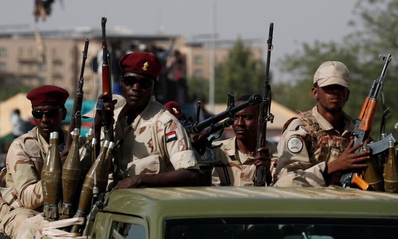 Sudanese soldiers are seen on their vehicles as they move with a military convoy outside the defense ministry compound in Khartoum, Sudan, April 25, 2019. Reuters