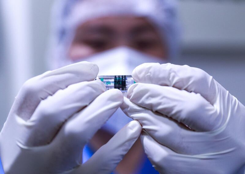 Abu Dhabi, United Arab Emirates, December 13, 2020.   Doctors and UAE residents get Covid-19 vaccinated at the Burjeel Hospital, Al Najdah Street, Abu Dhabi.  The Sinopharm vaccine.
Victor Besa/The National
Section:  NA