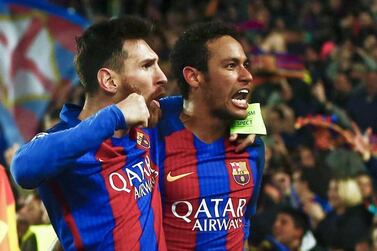 Lionel Messi, left, and Neymar celebrate after Barcelona defeated Paris Saint-Germain 6-1 at the Camp Nou to advance to the Uefa Champions League quarter-finals. Quique Garcia / EPA