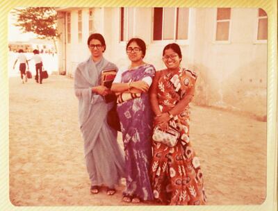 DUBAI , UNITED ARAB EMIRATES , March 27 – 2019 :- Rosy George ( right ) believed to be the longest serving school teacher ( 40 years ) for the Indian High School in Dubai in her old photo with the colleagues Annamma Jacob ( left ) and Mercy Mathews ( center ) at the old Indian High School building at the same place where the new Building school building is standing. ( Pawan Singh / The National ) For News. Story by Anna