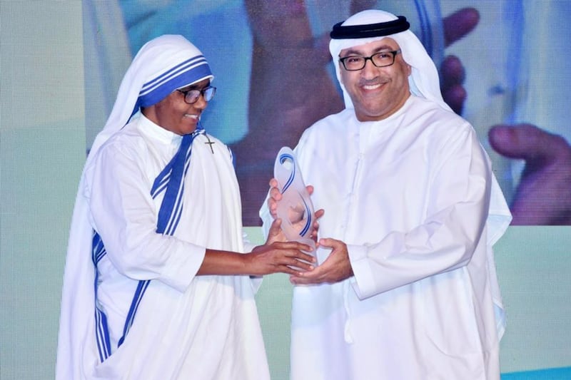 Dr Abdul Rahman Al Owais, Minister of Health and Prevention, receives the Mother Teresa Memorial International Award for Social Justice on behalf of Sheikh Abdullah bin Zayed. Wam