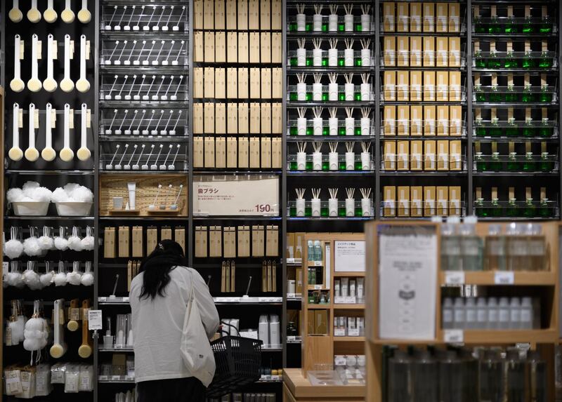 A customer looks at a toothbrush section at the store Muji in Tokyo, Japan, on December 2. Bloomberg
