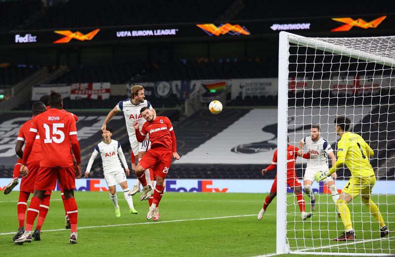 Spurs attacker Harry Kane heads at goal. Getty