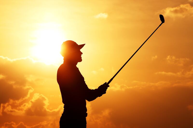 ABU DHABI, UNITED ARAB EMIRATES - JANUARY 19: A silhouette of Thorbjorn Olesen of Denmark playing his second shot on the eighteenth hole during day one of the Abu Dhabi HSBC Championship at Yas Links Golf Course on January 19, 2023 in Abu Dhabi, United Arab Emirates. (Photo by Warren Little / Getty Images)