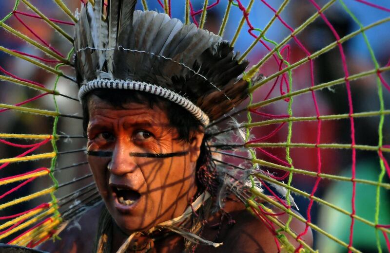 An indigenous man performs a ritual at a protest camp in Brasilia, Brazil. AFP