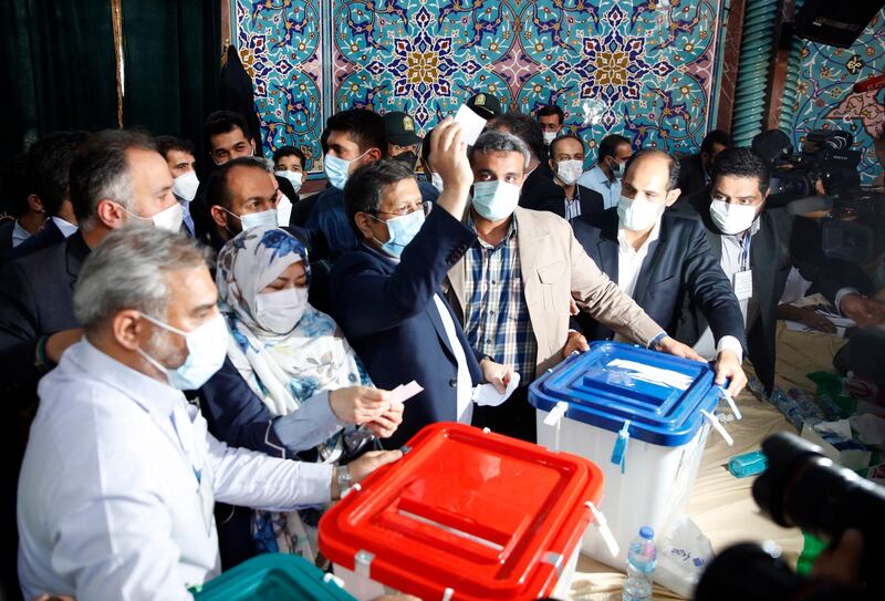 Iranian presidential candidate Abdolnasser Hemmati casts his vote at a polling station during the presidential election in Tehran. EPA