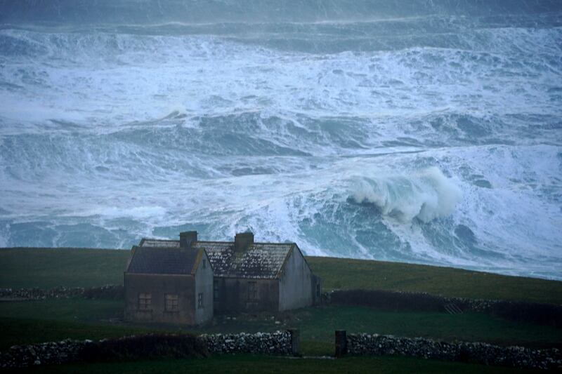 Waves crash against the shore in Doolin. PA