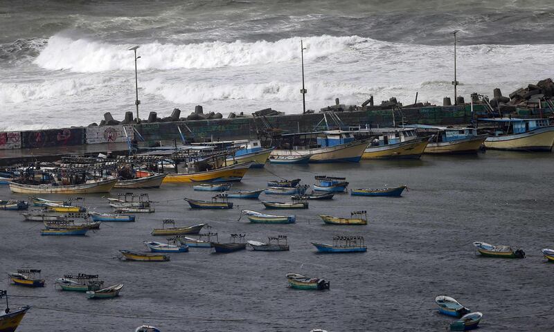 Boats of Palestinian fishermen are pictured off the coast of Gaza City, on a stormy day.  AFP