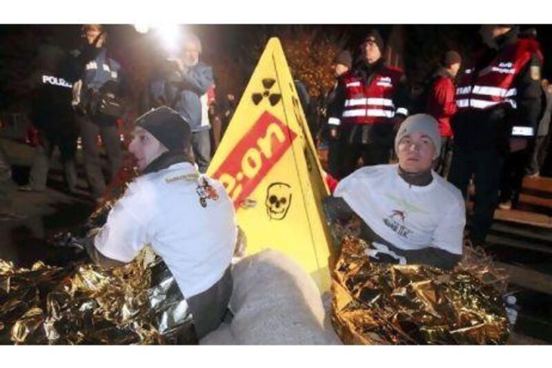 Nuclear protesters chain themselves to a concrete pyramid protest sign in Germany last week.
