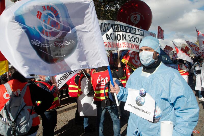 Medical workers demonstrate in Paris. AP Photo