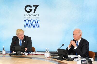 CARBIS BAY, CORNWALL - JUNE 11: British Prime Minister Boris Johnson and US President Joe Biden sit around the table at the top of the G7 meeting in Carbis Bay, on June 11, 2021 in Carbis Bay, Cornwall. UK Prime Minister, Boris Johnson, hosts leaders from the USA, Japan, Germany, France, Italy and Canada at the G7 Summit. This year the UK has invited India, South Africa, and South Korea to attend the Leaders' Summit as guest countries as well as the EU. (Photo by Leon Neal - WPA Pool/Getty Images) (Photo by Leon Neal/Getty Images)
