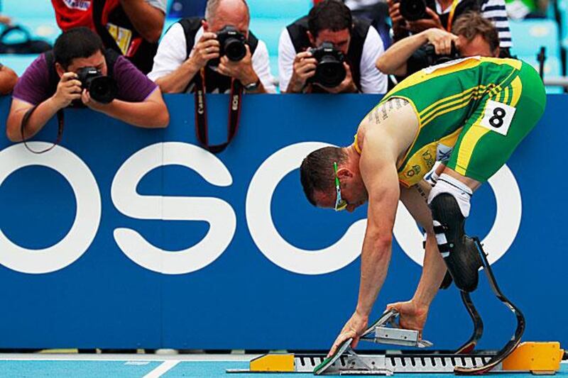 The South African double amputee Oscar Pistorius settles down into his blocks during his 400 metres heat.

DIEGO AZUBEL / EPA