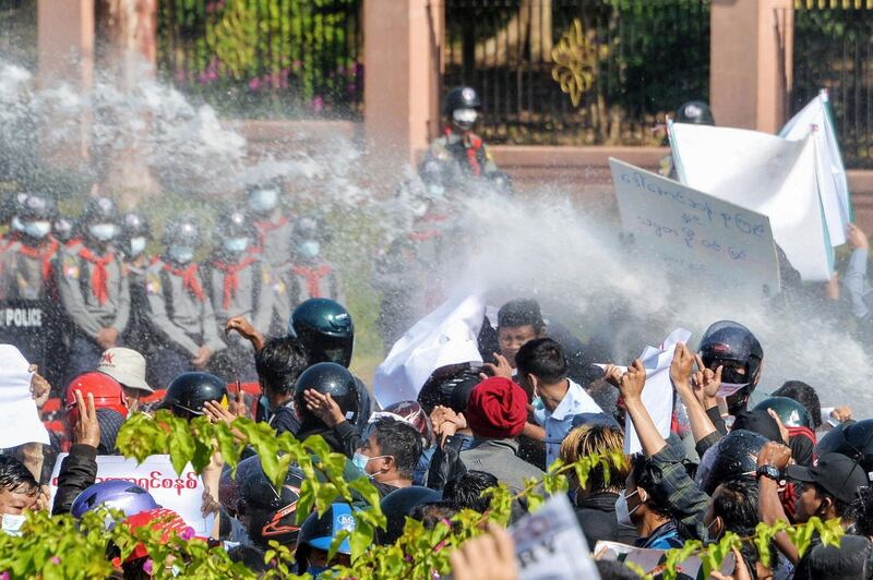 Myanmar police fire water cannon at protesters as they continue to demonstrate against the February 1 military coup in the capital Naypyidaw. AFP